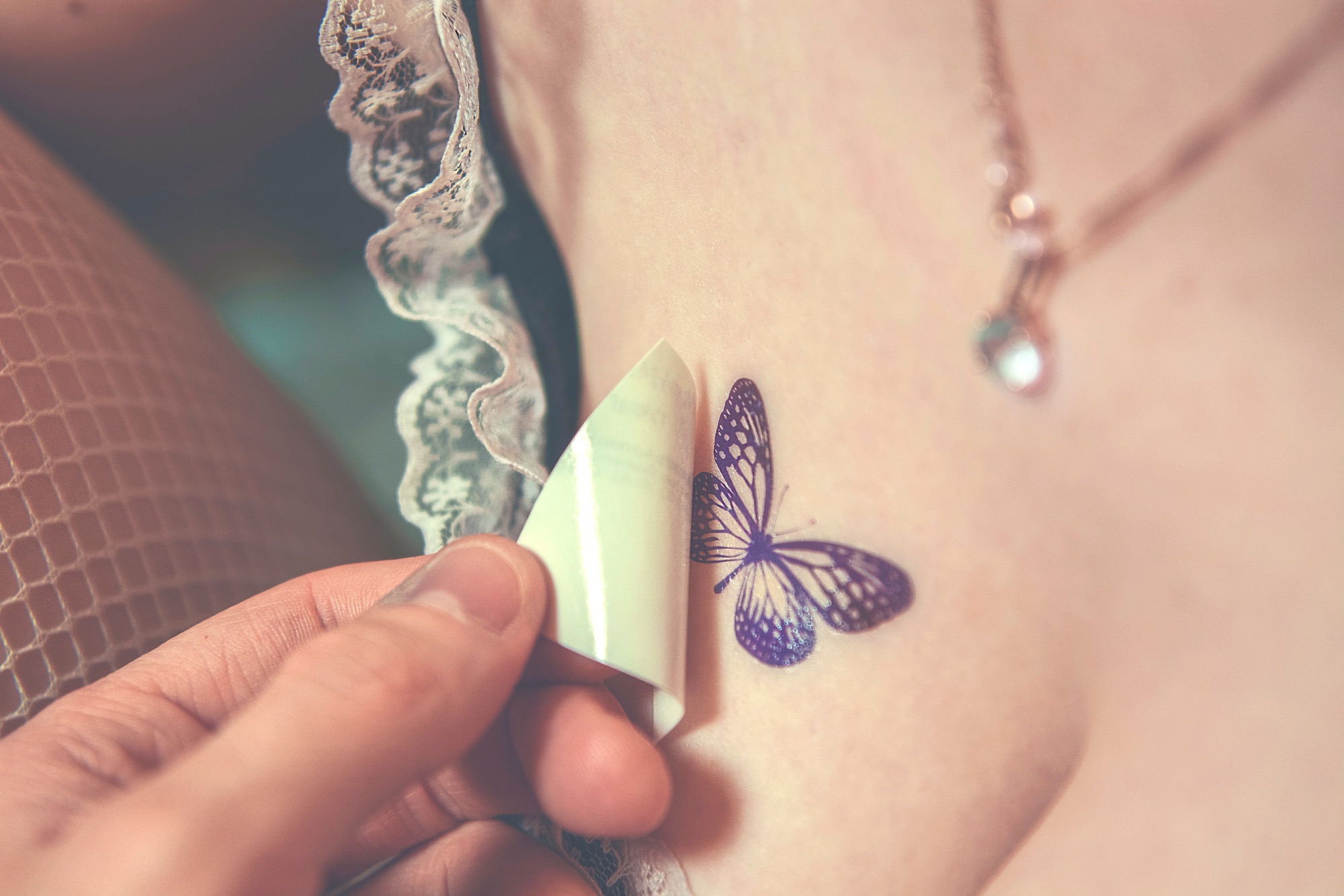 Butterfly tattoo on a woman's chest